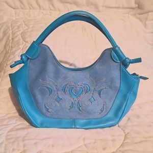 Electric blue colored shoulder bag with embellishments